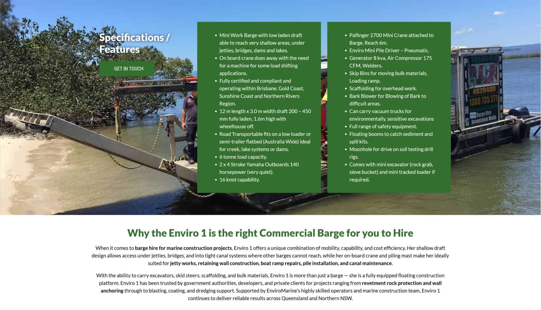 Heavy-duty barge with equipment on water for commercial construction projects.